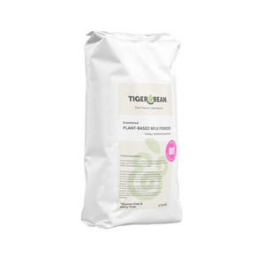 A white sack of sweetened plant-based milk powder weighing 15 kg. Packaging states it is gluten-free and dairy-free and is used in the production of dairy-free alternatives to milk chocolate and white chocolate. A pink sticker states that it is recipe number 001 made with horchata de chufa, otherwise known as sweetened tigernut milk.